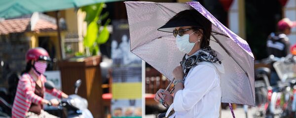 Женщина на одной из улиц Дананга, Вьетнам - Sputnik Грузия