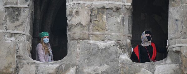 Женщины в масках в церкви  - Sputnik Грузия