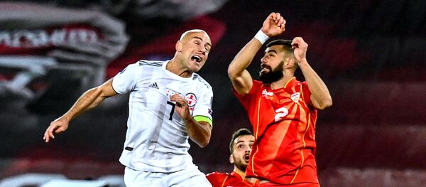 Джаба Канкава. Матч между сборными Грузии и Македонии по футболу при пустых трибунах на стадионе Динамо Арена  - Sputnik Грузия