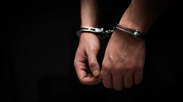 Арестованный в наручниках - Sputnik Грузия