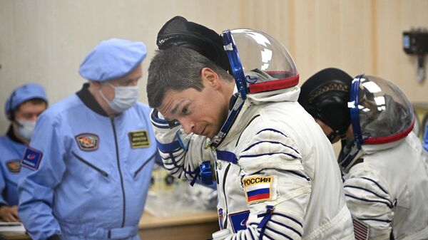 Член основного экипажа космонавт Роскосмоса Олег Кононенко  - Sputnik Грузия