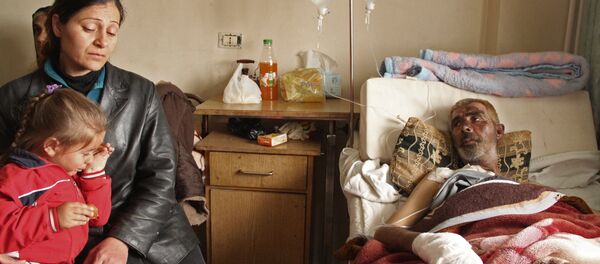 Жители сирийской деревни Мабуджа, пострадавшие от нападения боевиков ИГИЛ - Sputnik Грузия