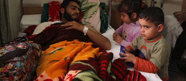 Жители сирийской деревни Мабуджа, пострадавшие от нападения боевиков ИГИЛ - Sputnik Грузия