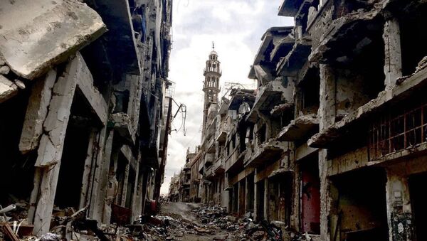 Разрушенные здания в сирийском городе Хомсе. - Sputnik Грузия
