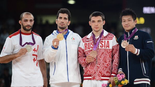 Борец из Грузии Реваз Лашхи, завоевавший серебряную медаль на Олимпийских играх 2012 года в Лондоне. - Sputnik Грузия