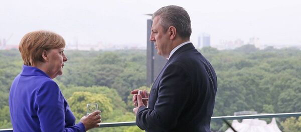 ანგელა მერკელი და გიორგი კვირიკაშვილი ანგელა მერკელი და გიორგი კვირიკაშვილი - Sputnik საქართველო