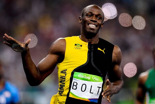 Ямайский спортсмен Усэйн Болт в финальном забеге на 100 м во время соревнований среди мужчин по легкой атлетике на XXXI летних Олимпийских играх Ямайский спортсмен Усэйн Болт в финальном забеге на 100 м во время соревнований среди мужчин по легкой атлетике на XXXI летних Олимпийских играх - Sputnik Грузия