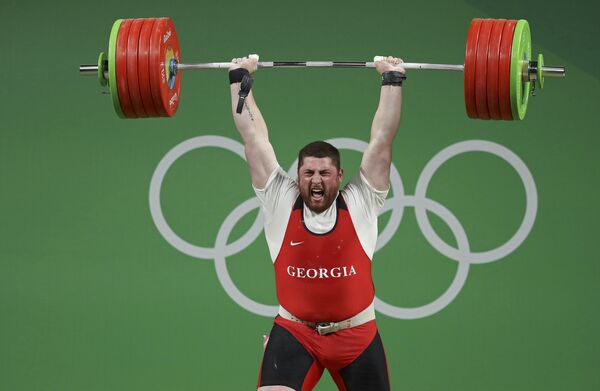 Своей победой Лаша Талахадзе принес Грузии первую золотую олимпийскую медаль на XXXI летних Олимпийских играх в Рио-де-Жанейро. - Sputnik Грузия