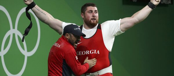 Тяжеловес из Грузии Лаша Талахадзе завоевывает золотую медаль на Олимпиаде в Рио Тяжеловес из Грузии Лаша Талахадзе завоевывает золотую медаль на Олимпиаде в Рио - Sputnik Грузия