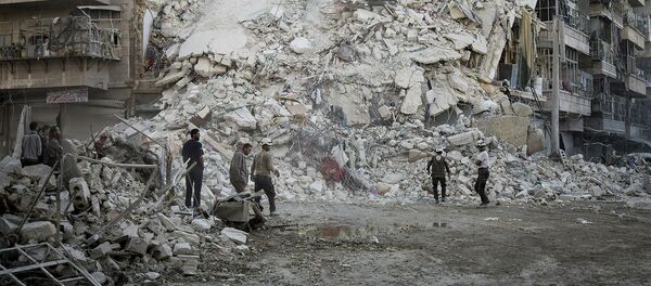 Разрушенные дома в Алеппо после боев сирийской армии с боевиками ИГ - Sputnik Грузия