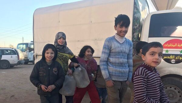 Жители Алеппо после вывода боевиков и членов их семей из восточного Алеппо - Sputnik Грузия