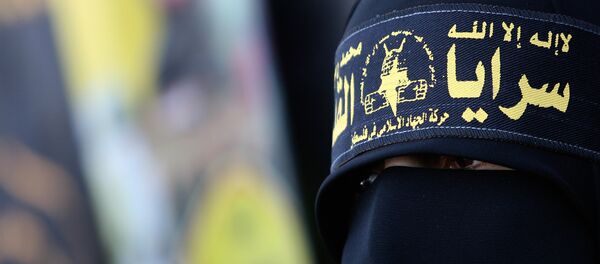  Палестинская женщина, одетая в повязку «Исламский джихад» - Sputnik Грузия