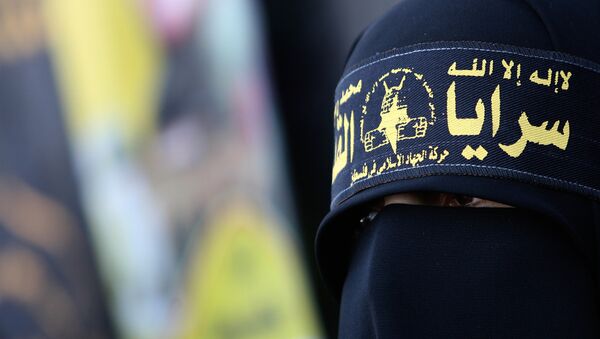  Палестинская женщина, одетая в повязку «Исламский джихад» - Sputnik Грузия