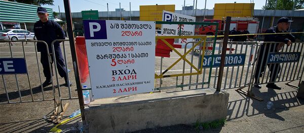 Торговый центр автозапчастей, автомобильных масел и аксессуаров на рынке Элиава после пожара - Sputnik Грузия