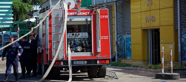 Торговый центр автозапчастей, автомобильных масел и аксессуаров на рынке Элиава после пожара - Sputnik Грузия