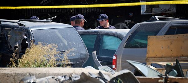 Полицейские на авторынке в Исани после пожара - Sputnik Грузия