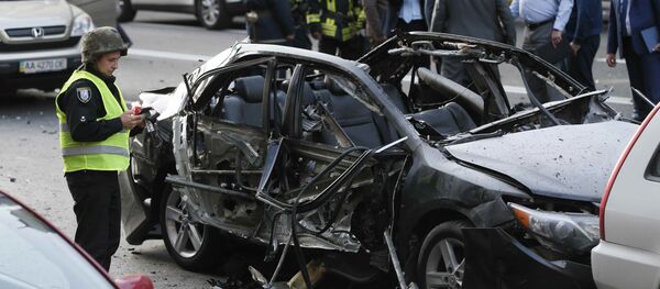 Следователи и полиция на месте взрыва в Киеве Следователи и полиция на месте взрыва в Киеве - Sputnik Грузия