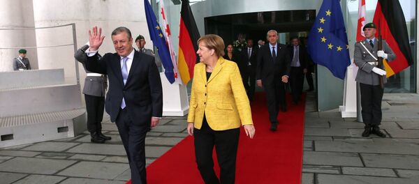 Георгий Квирикашвили и Ангела Меркель - Sputnik Грузия