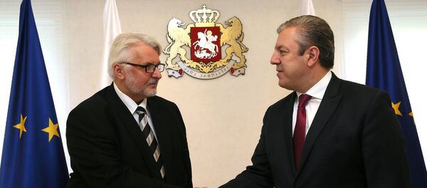 Министр иностранных дел Польши Витольд Ващиковский и премьер-министр Грузии Георгий Квирикашвили - Sputnik Грузия