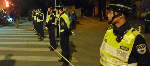 Китайские полицейские в оцеплении на месте взрыва - Sputnik Грузия