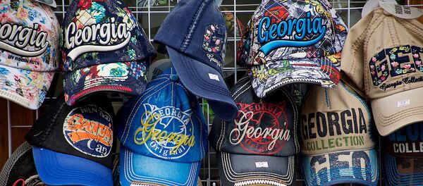 Бейсболки для туристов с надписями Georgia Бейсболки для туристов с надписями Georgia - Sputnik Грузия