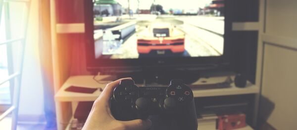 Геймер играет в видеоигру - Sputnik Грузия