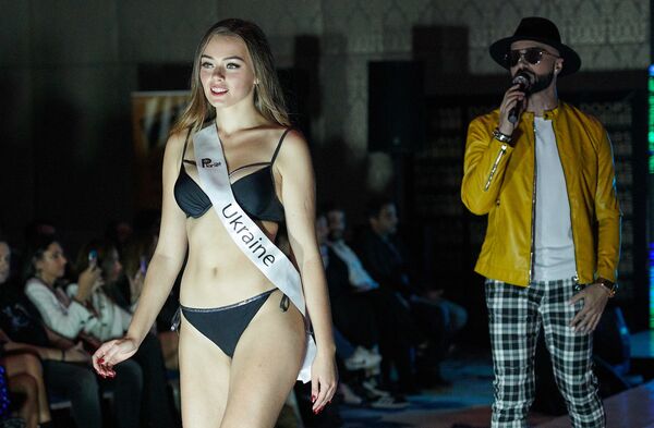 Обладателем титула Miss Planet – 2018 стала модель из Украины Алена Фирут. На фото - она идет по подиуму в купальном костюме - Sputnik Грузия