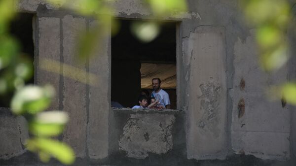 Здания в районе Вашлиджвари, которые захватили вынужденные переселенцы - Sputnik Грузия