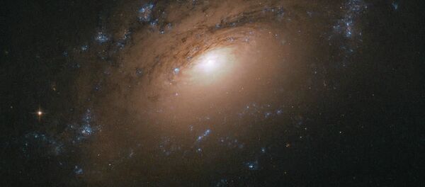 Спиральная галактика NGC 3169 снятая телескопом Хаббл - Sputnik Грузия
