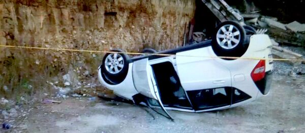 Перевернувшийся в результате ДТП автомобиль - Sputnik Грузия