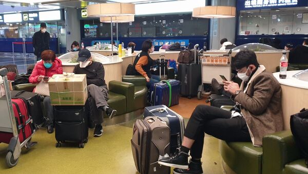 Туристы в аэропорту Шоуду в Пекине - Sputnik Грузия