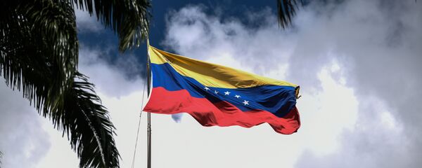 Флаг на здании Национальной ассамблеи Венесуэлы в Каракасе - Sputnik Грузия