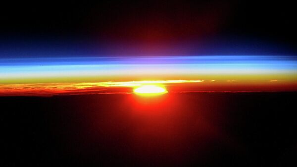Закат солнца с борта Международной космической станции - Sputnik Грузия