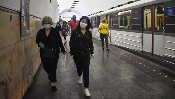  Городской транспорт. Пассажиры в масках в метро - Sputnik Грузия